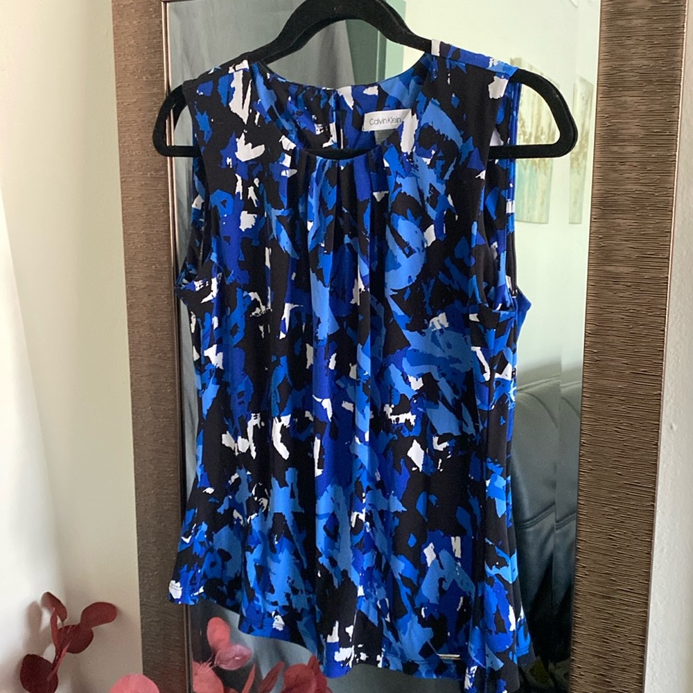 Calvin Klein medium business top. Blue, black and white.